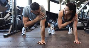 Toning Bingo Wings: Your Ultimate Guide to Sculpting Sleek Arms at the Gym 3 Fitness trainer demonstrating arm toning exercises Newmarket