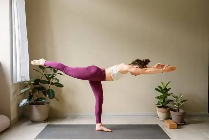 Woman doing Yoga exercise Newmarket to help with toning the body. 