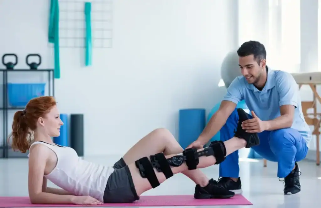 Woman having treatment to help muscle recovery Newmarket after an injury