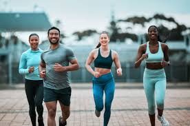 Sculpting Sleek Arms: The Essential Role of Cardio in Toning Without Bulking Up 3 image of people running to incorporate cardio Newmarket exercise into their life to help tone arms and body.